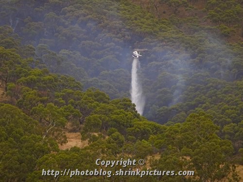 Helicopter dumping water