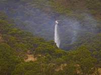 Helicopter dumping water